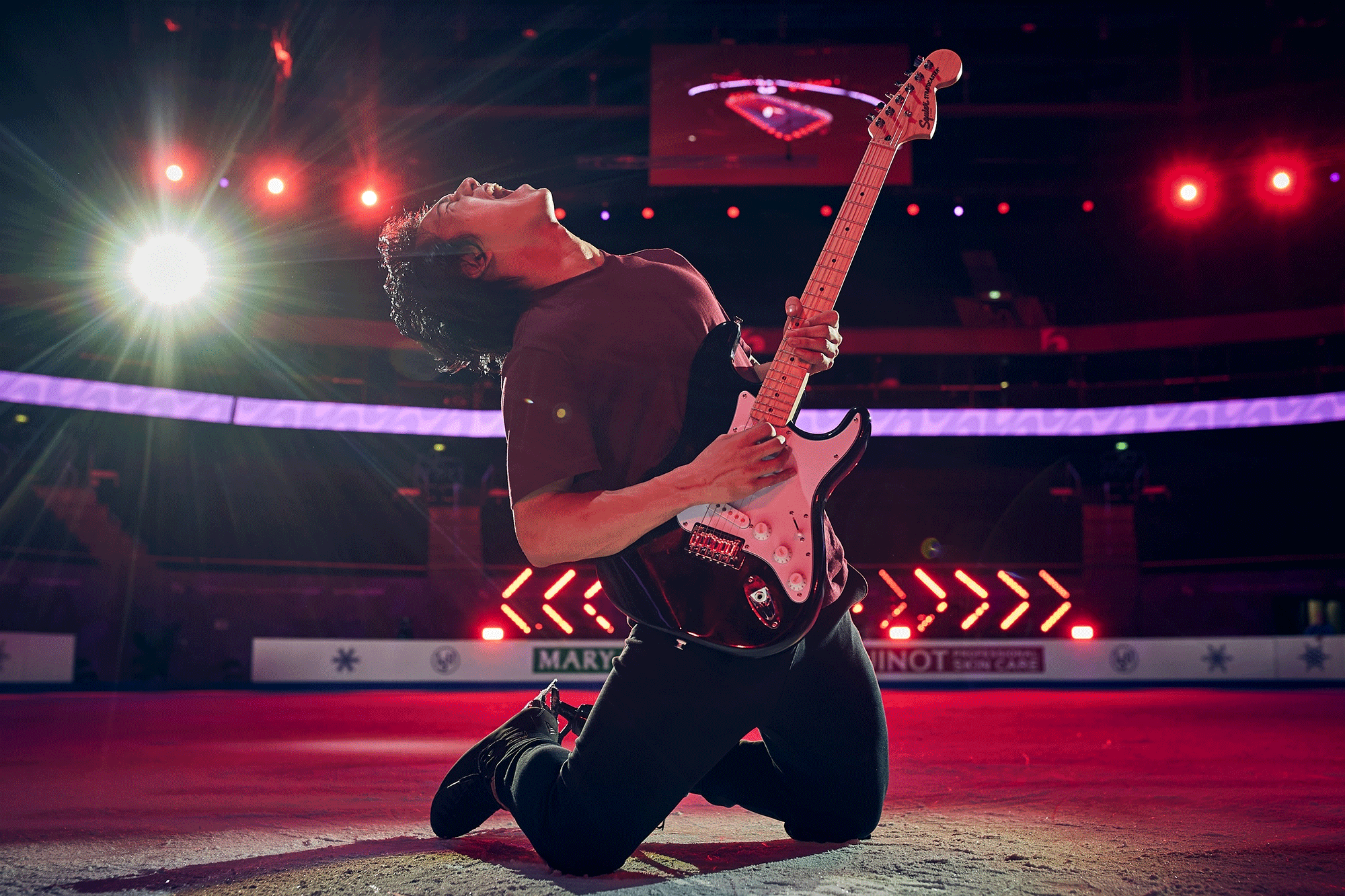 Adam Siao Him Fa of France plays guitar on ice for a photograph during the ISU European Figure Skating Championships at Zalgirio Arena on January 14, 2024 in Kaunas, Lithuania.